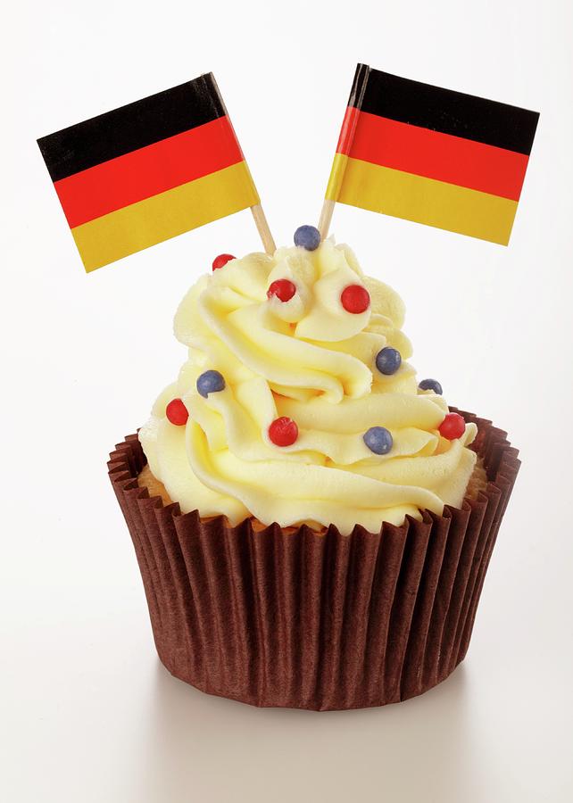 A Cupcake Decorated With Buttercream And German Flags Photograph by Foodfolio