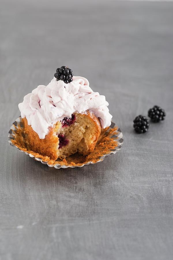 A Cupcake With Blackberries And Blackberry Cream Photograph by Mandy Reschke