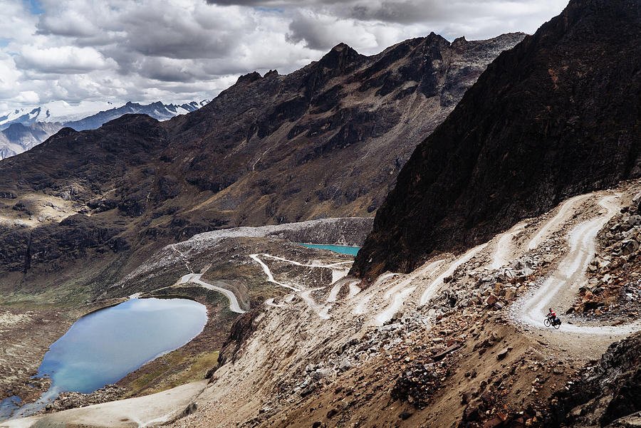 A cyclist descending from the Punta Olimpica Pass in Peru Photograph by Kamran Ali