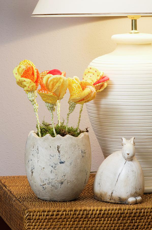 A Decorated Easter Nest With Yellow Fabric Flowers And A Ceramic Rabbit Photograph by Inge Ofenstein