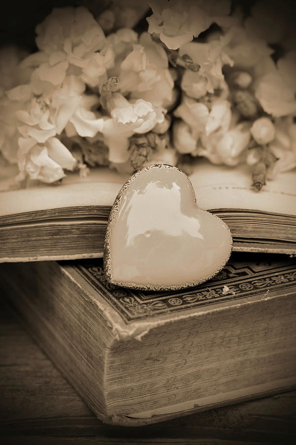 A Decorative Heart On A Book With Flowers Photograph by Angelica Linnhoff