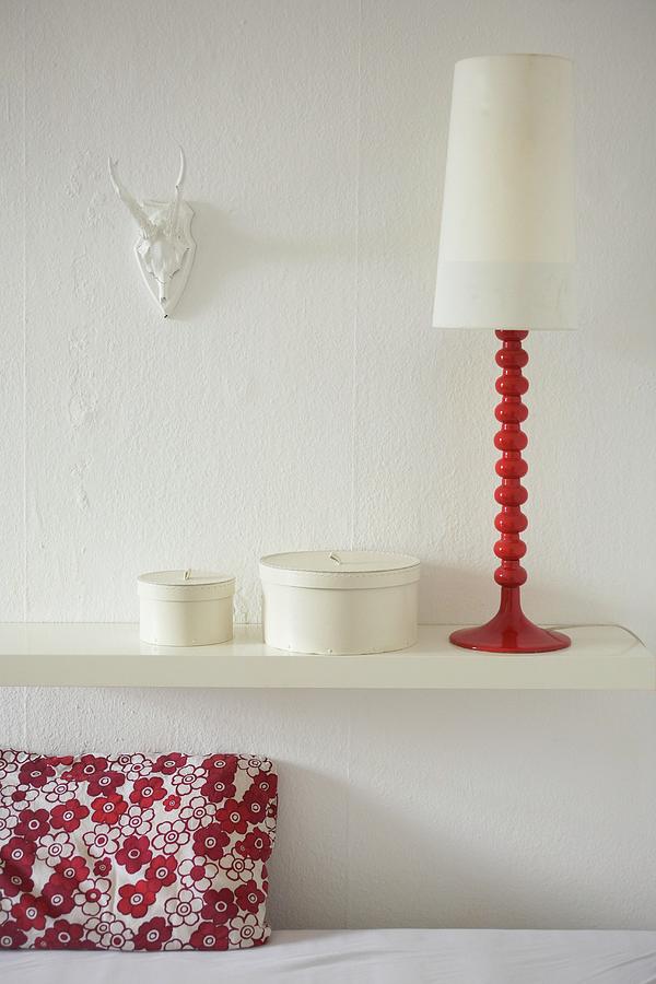A Decorative Retro Lamp And Round Boxes On A White Shelf Photograph by Heidi Frhlich