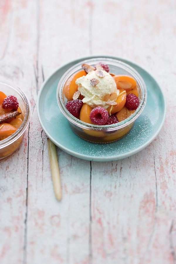 A Dessert With Apricots, Raspberries And Cinnamon Cream Photograph by Michael Wissing