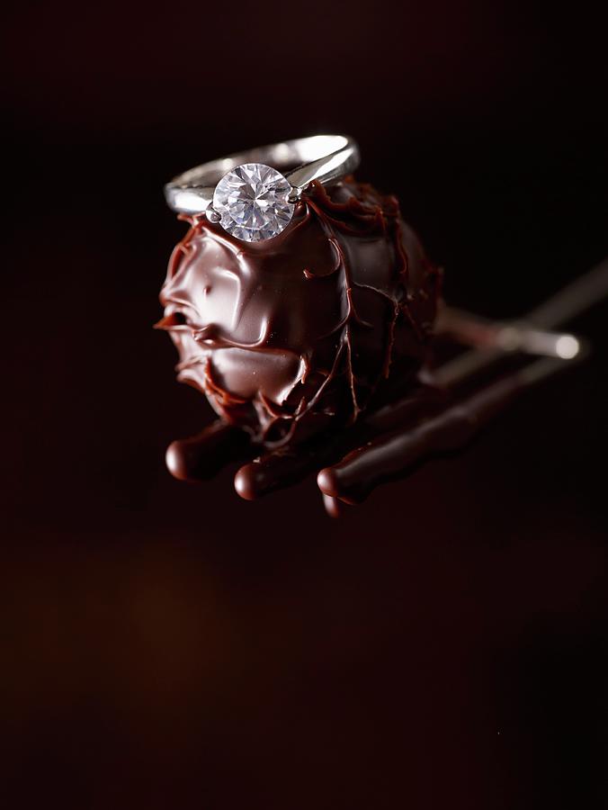 A Diamond Ring On A Chocolate Truffle Photograph by Oliver Brachat