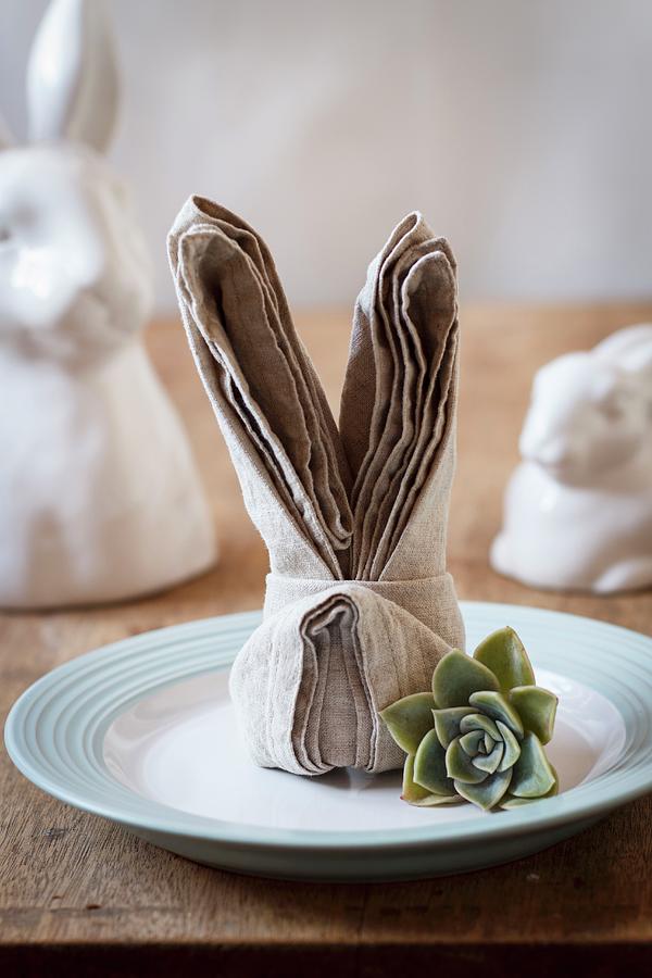 A Dinner Place Set With A Folded Bunny Napkin And A Succulent Plant Photograph by Great Stock!