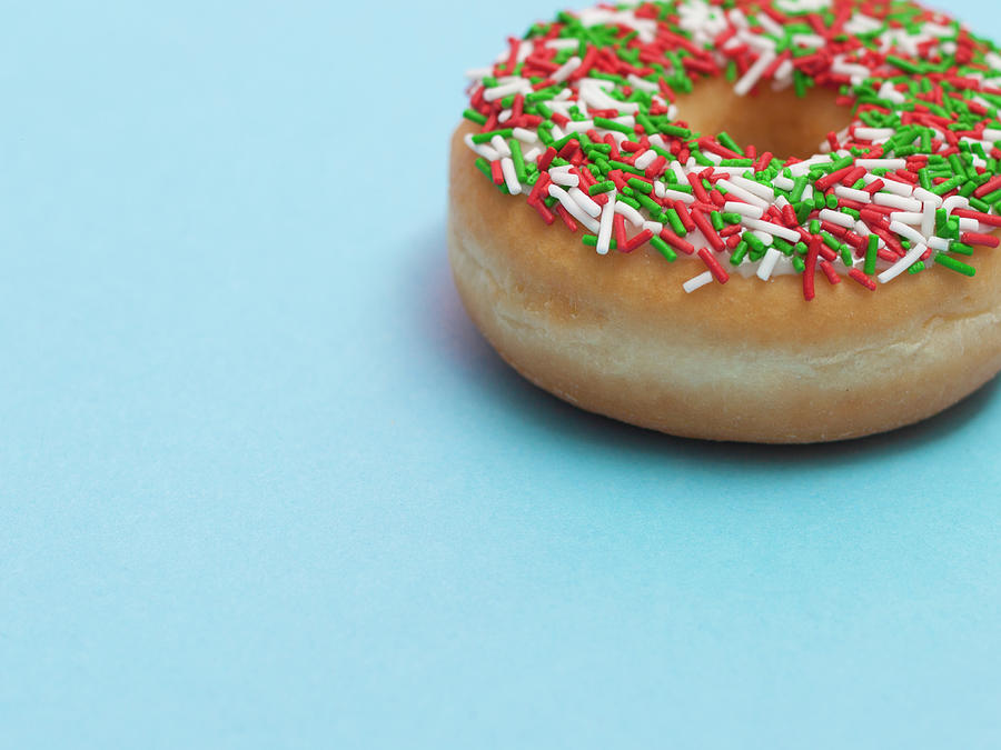 A Donut With Sprinkles On A Blue Photograph by Steven Errico
