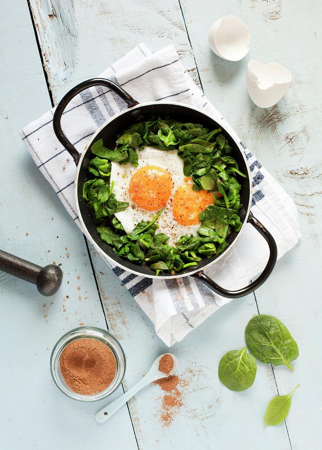 A Double Yolked Egg With Nutmeg On A Spinach Salad seen From Above Photograph by Jane Saunders