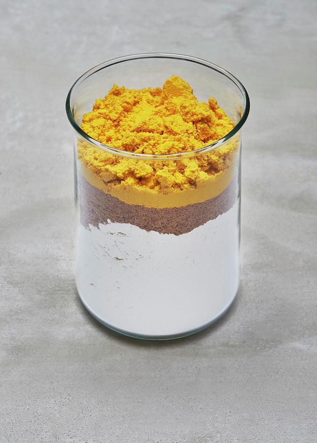 A Dry Baking Mixture For An Algae Gugelhupf In A Glass Jar Photograph by Hans Gerlach