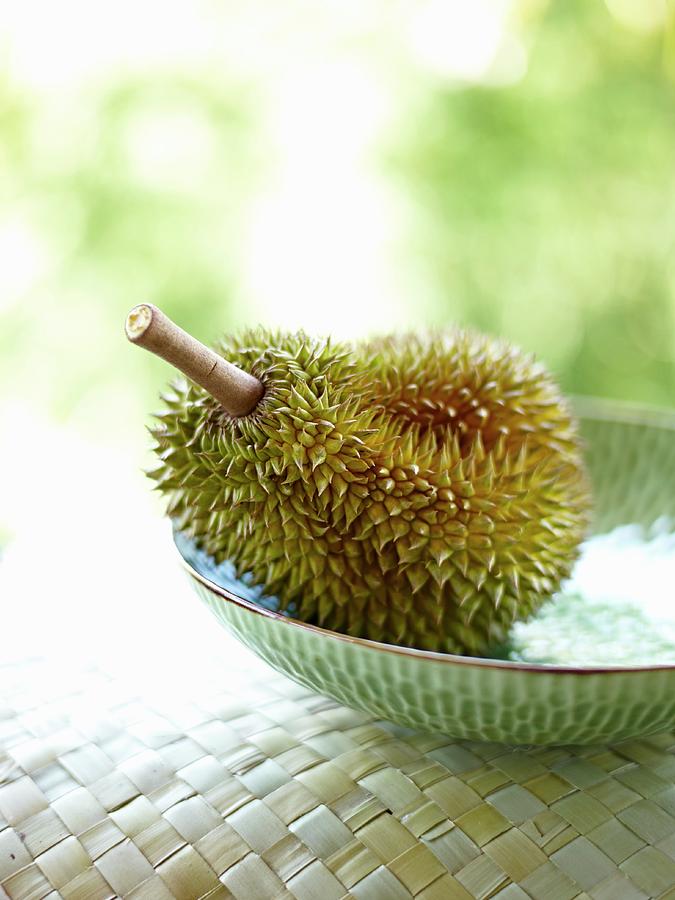 Fruit Photograph - A Durian In A Bowl by Oliver Brachat