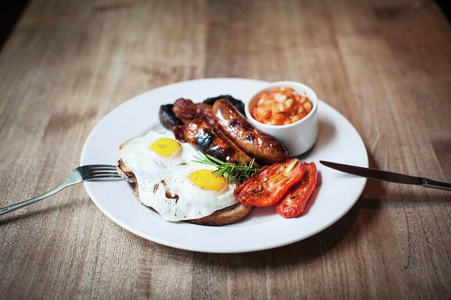 A English Breakfast With Sausages, Fried Eggs And Beans Photograph by Helen Cathcart