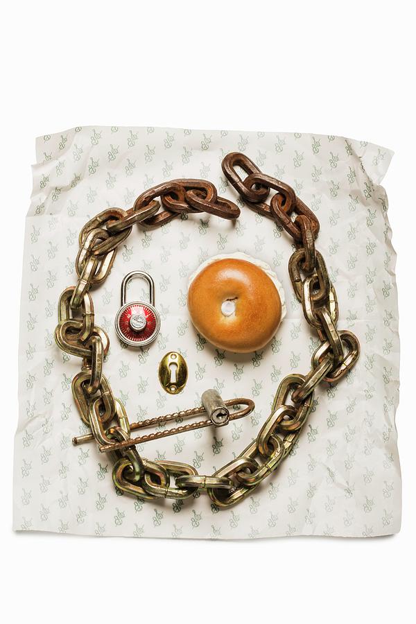 A Face Made From A Bagel, An Iron Chain And A Padlock Photograph by Colin Cooke