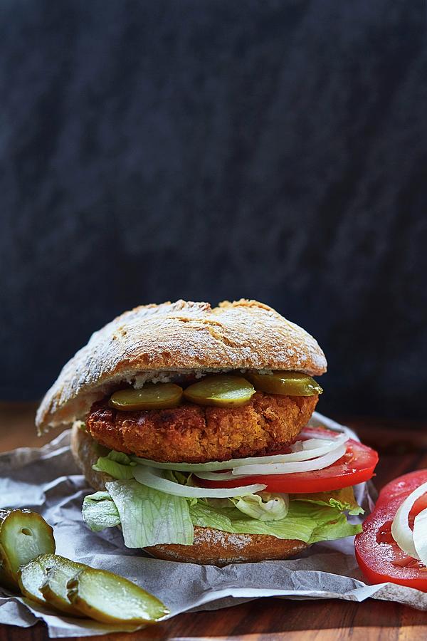 A Falafel Veggie Burger Photograph by Helena Krol