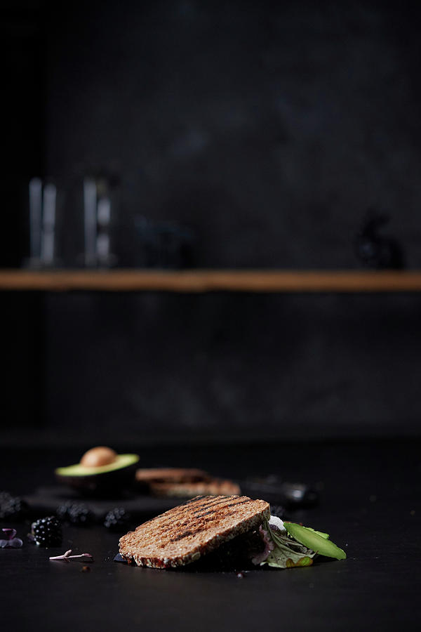 A Fallen Sandwich With Avocado, Blackberries And Salad Photograph by Nikolai Buroh