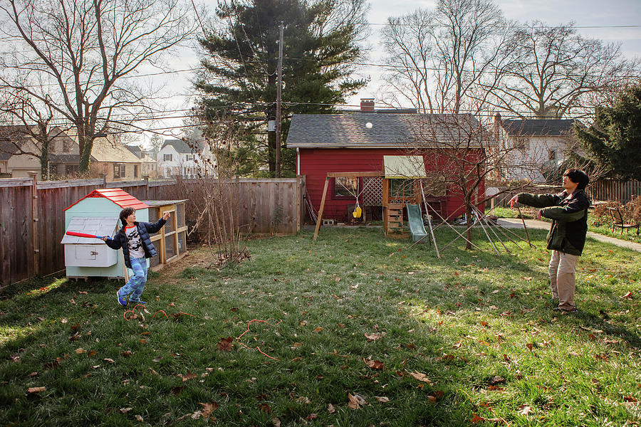 Baseball Photograph - A Father And Son Play Baseball Together In Backyard In Autumn by Cavan Images / Rebecca Tien