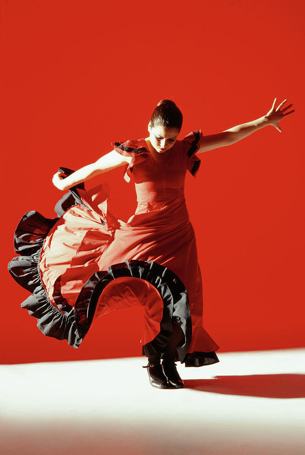 A Female Flamenco Dancer Performing A Photograph by George Doyle