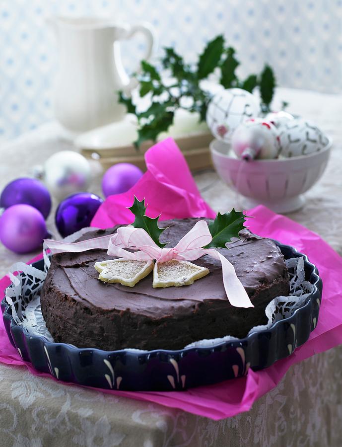 A Festive Christmas Chocolate Cake Decorated With A Ribbon Photograph by Mikkel Adsbl