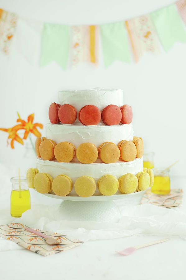 A Festive, Three-tier Cake Decorated With Macaroons Photograph by Kristy Snell