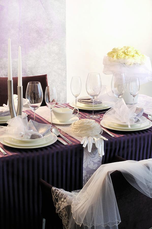 A Festively Laid Wedding Reception Table With Purple Table Runners And Decorative Bows Photograph by Inge Ofenstein