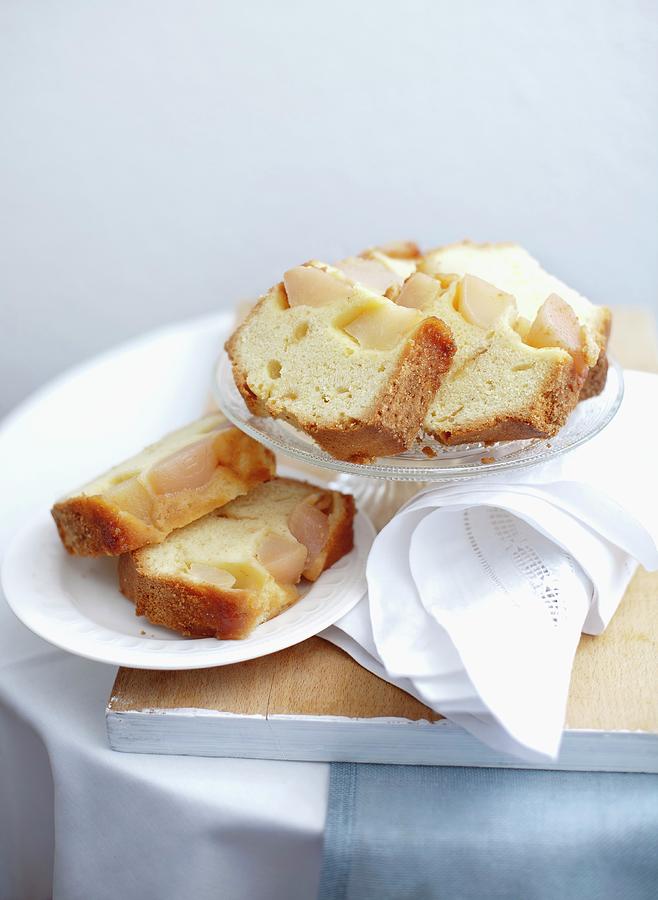 A Few Slices Of Upside-down Pear Cake On Cake Plates Photograph by Ira Leoni