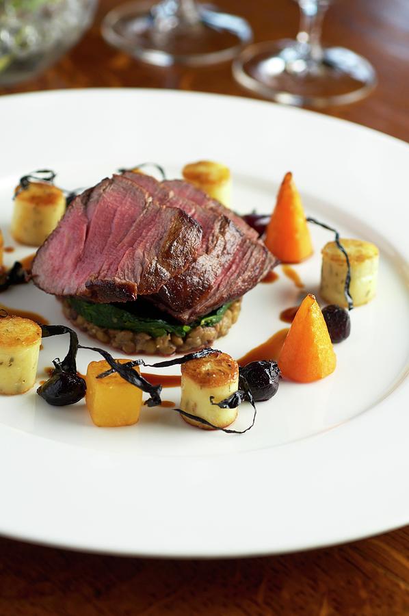 A Fillet Of Angus Beef On Lentils Photograph by Tim Green