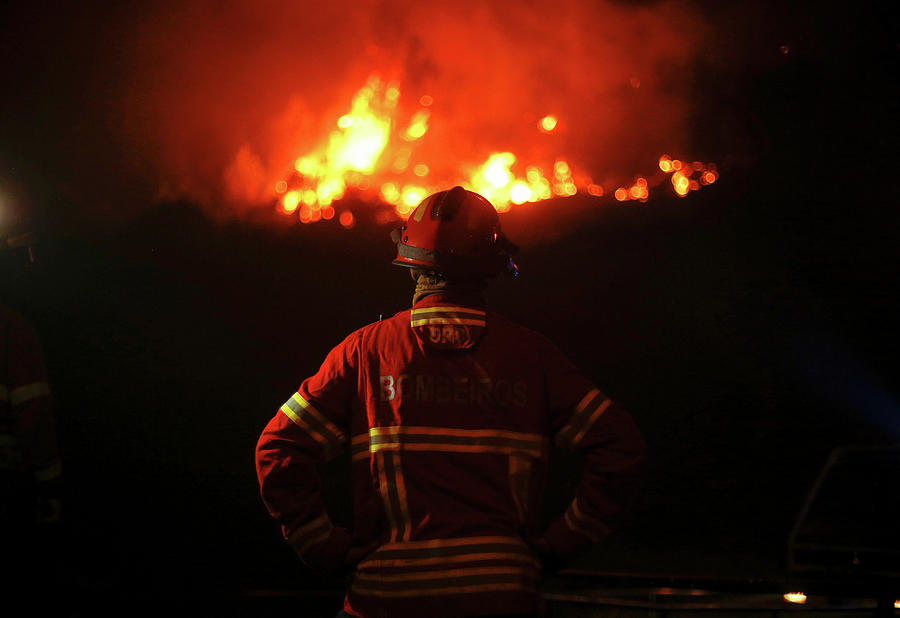 A Firefighter Watches an Approaching Photograph by Rafael Marchante ...