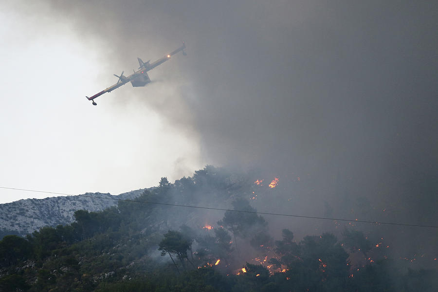 A Firefighting Plane Drops Water Photograph By Antonio Bronic - Pixels