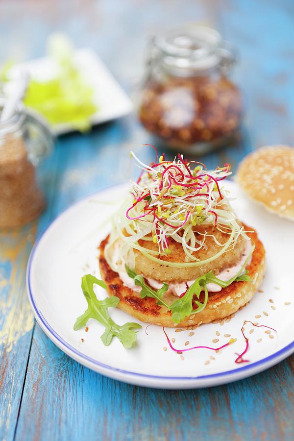 A Fish Burger With Pink Sauce And Bean Sprouts Photograph by Viola Cajo