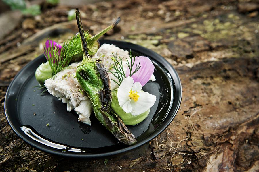 A Fish Fillet With Grilled Chillies Served With Flowers On A Camping Plate Photograph by Lode Greven Photography
