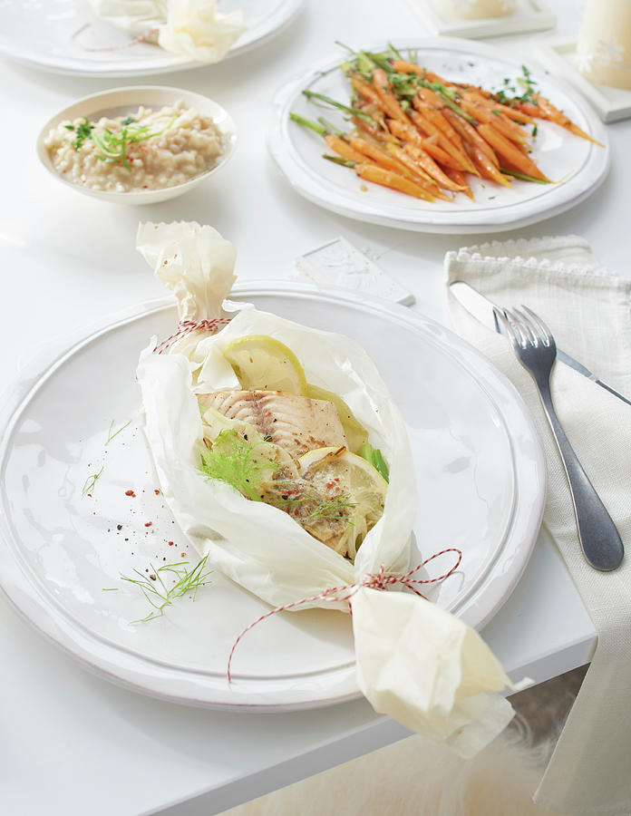 A Fish Parcel With Fennel, Lemon Butter, Carrots And Risotto For Christmas Photograph by Jan-peter Westermann