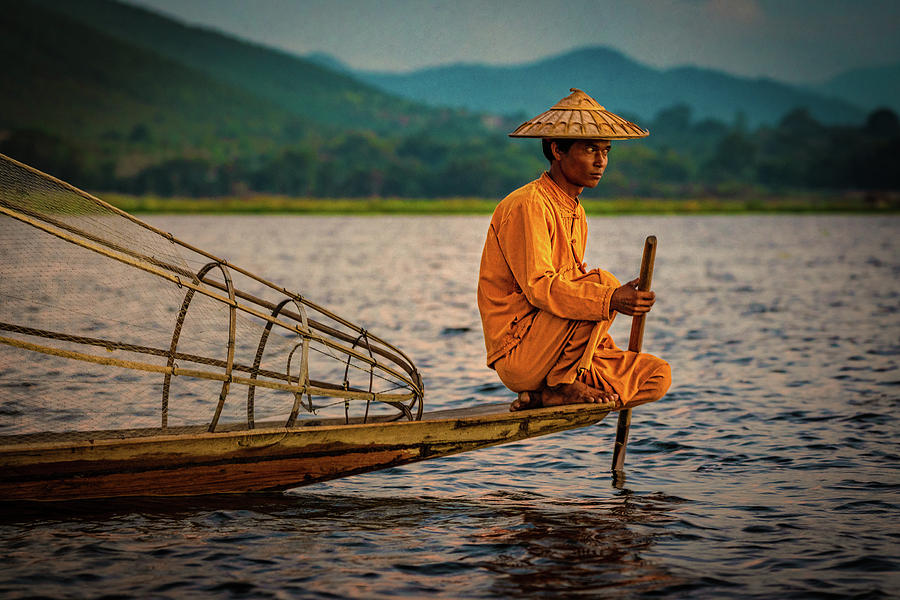 A Fisherman Of Inle Lake Photograph by Chris Lord
