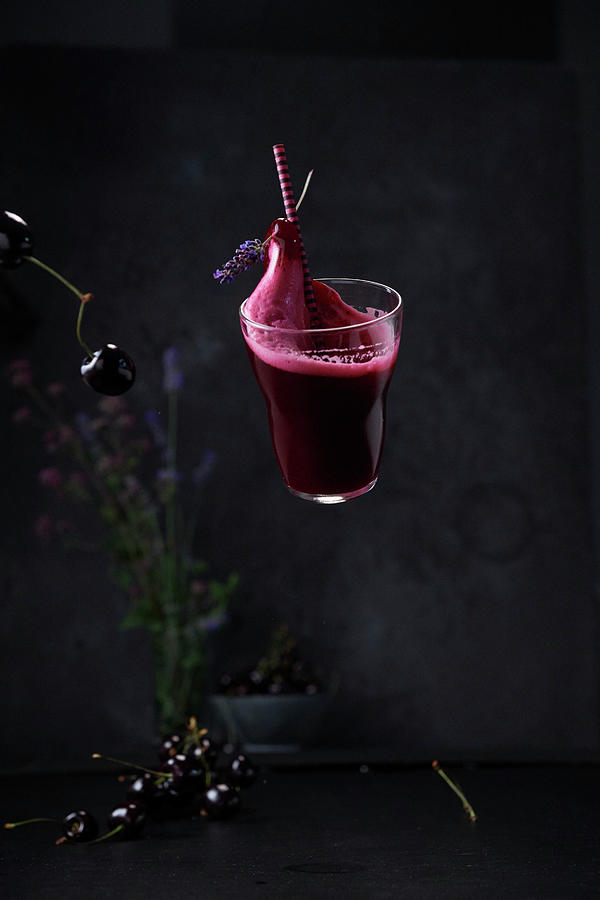 A Floating Gin Sour With Beetroot And Cherries Photograph by Nikolai Buroh