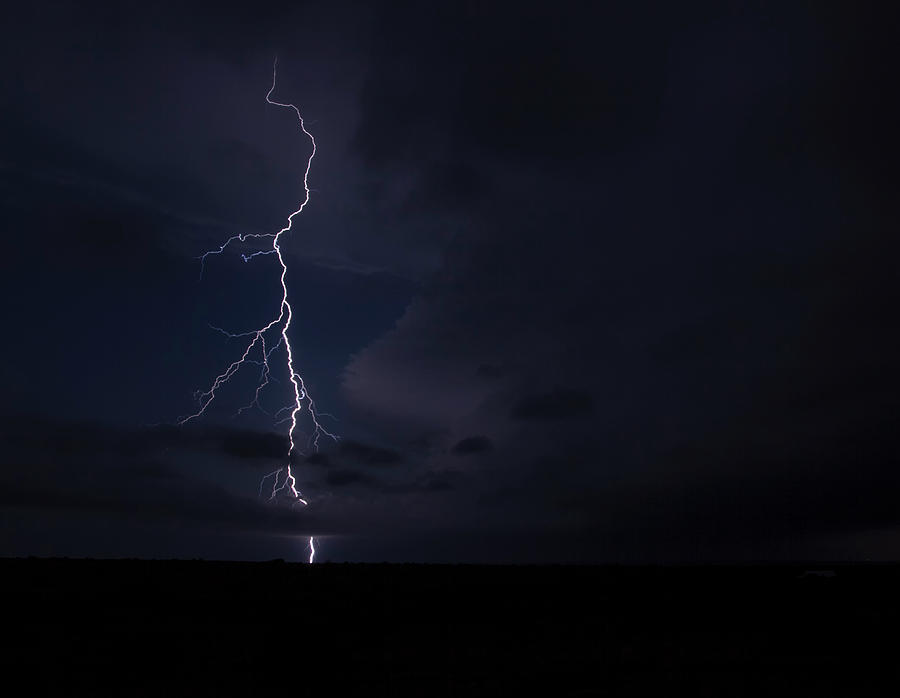 A Forking Lightning Bolt Arcs From The Anvil Of A Tornadic Thunderstorm ...