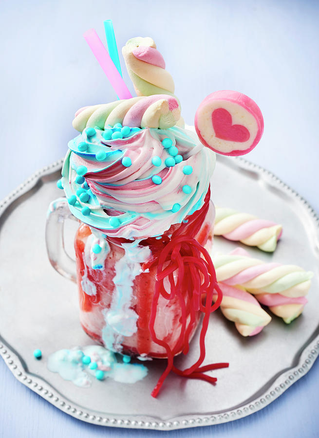 A Freak Shake Topped With Cream, Sprinkles, Marshmallows, Lollies And Strawberry Laces Photograph by Stefan Schulte-ladbeck