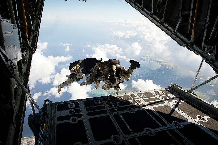 Guam Photograph - A Free Fall Jump From A C-130 Hercules by Stocktrek Images Guam Photograph - A Free Fall Jump From A C-130 Hercules by Stocktrek Images