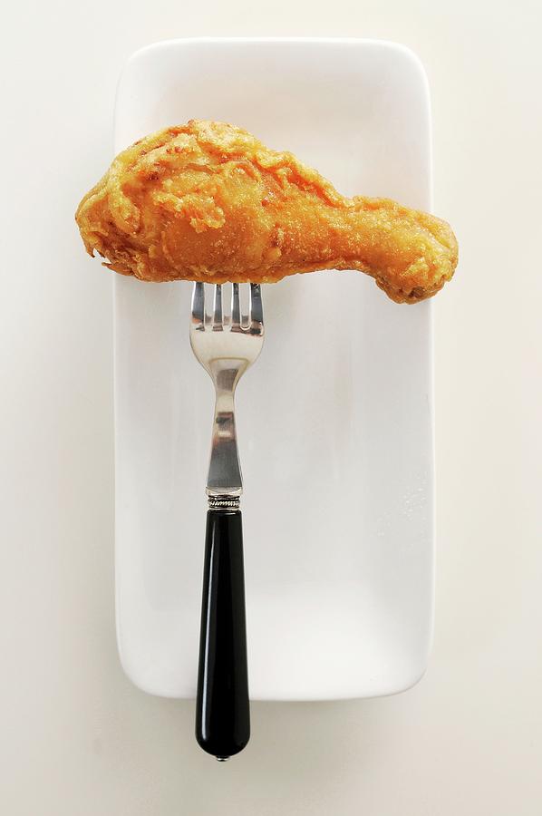 A Fried Drumstick On A Fork Photograph by Mueller, Adrian