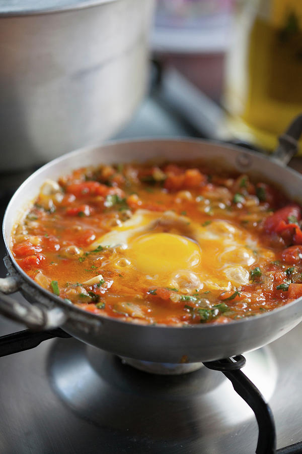A Fried Egg In Tomato Sauce Photograph by Eising Studio
