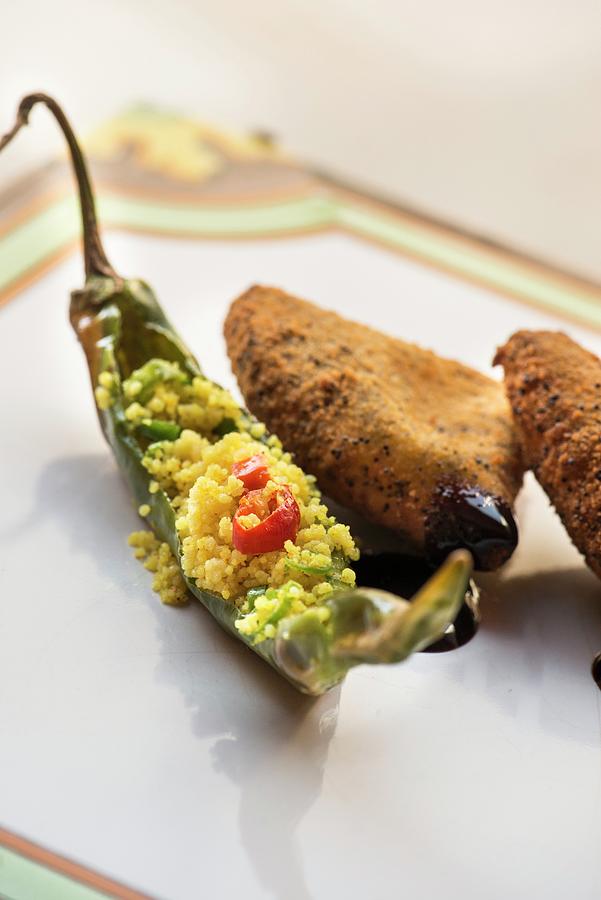 A Fried Friggitello Pepper Filled With Turmeric Couscous And Caciocavallo Cheese With A Poppyseed Crust From The Restaurant Farmacia Dei Sani In Ruffano Italy Photograph By Jalag Stefano Scat