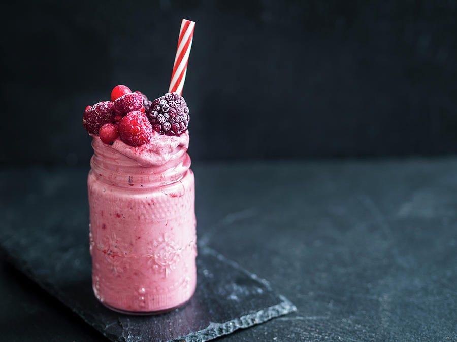A Frozen Smoothie With Berries In Glass With A Straw vegan Photograph by Magdalena Paluchowska