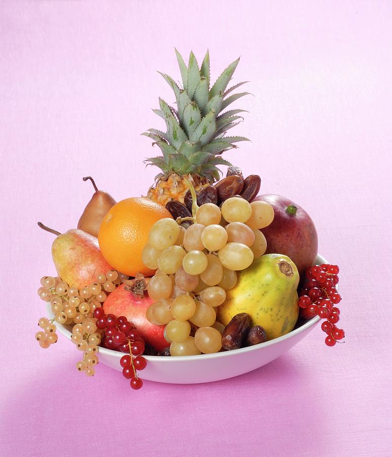 A Fruit Arrangement With Pineapple And Dates Photograph by Franco Pizzochero