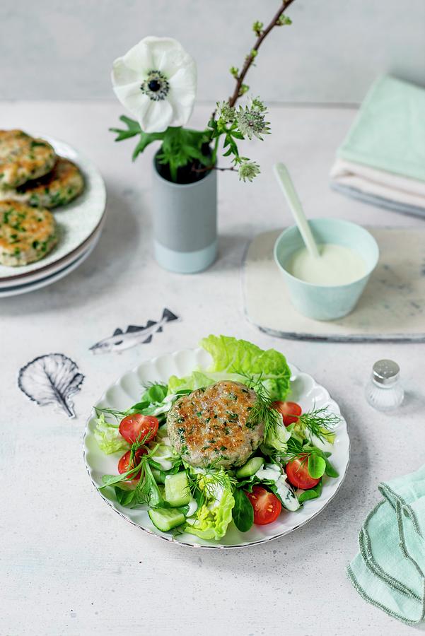 A Garden Salad With A Horseradish Dressing And Fish Burgers Photograph by Carolin Strothe