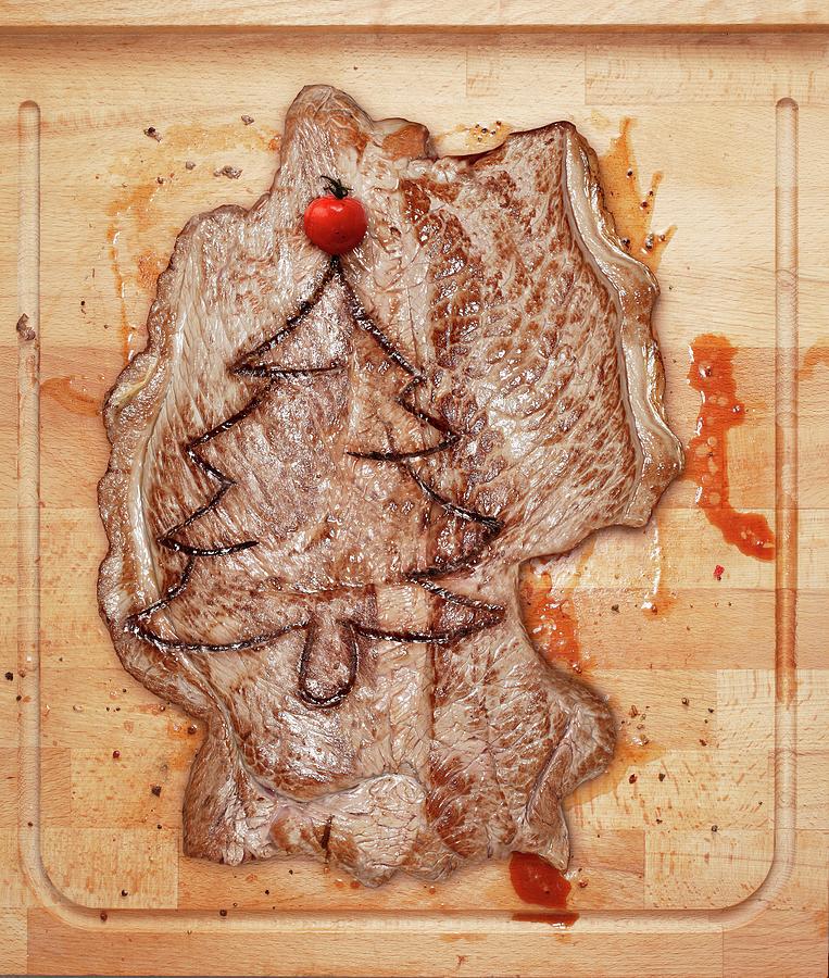 A Germany-shaped Steak Branded With A Christmas Tree Photograph by Krger & Gross