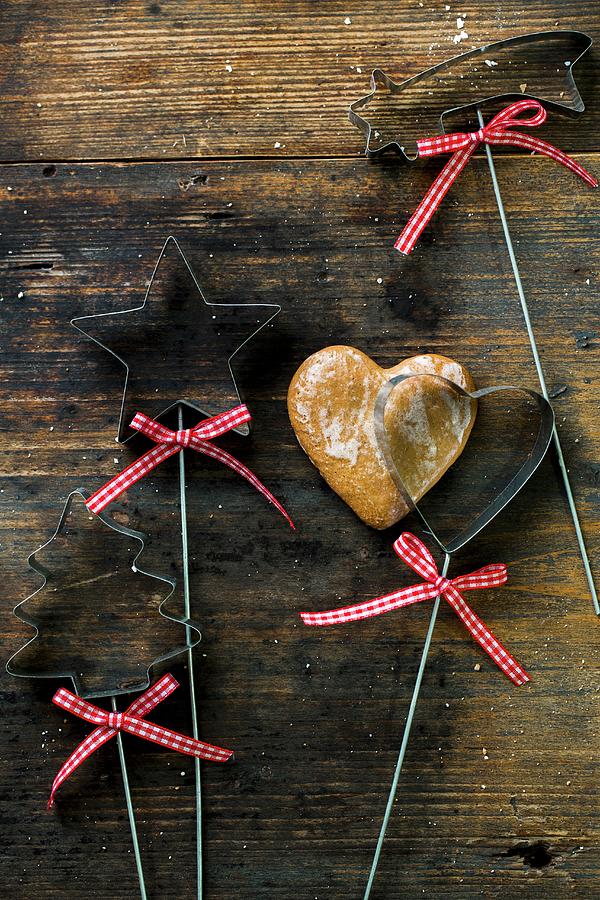 A Gingerbread Heart With Cookie Cutters Photograph by Sandra Krimshandl-tauscher