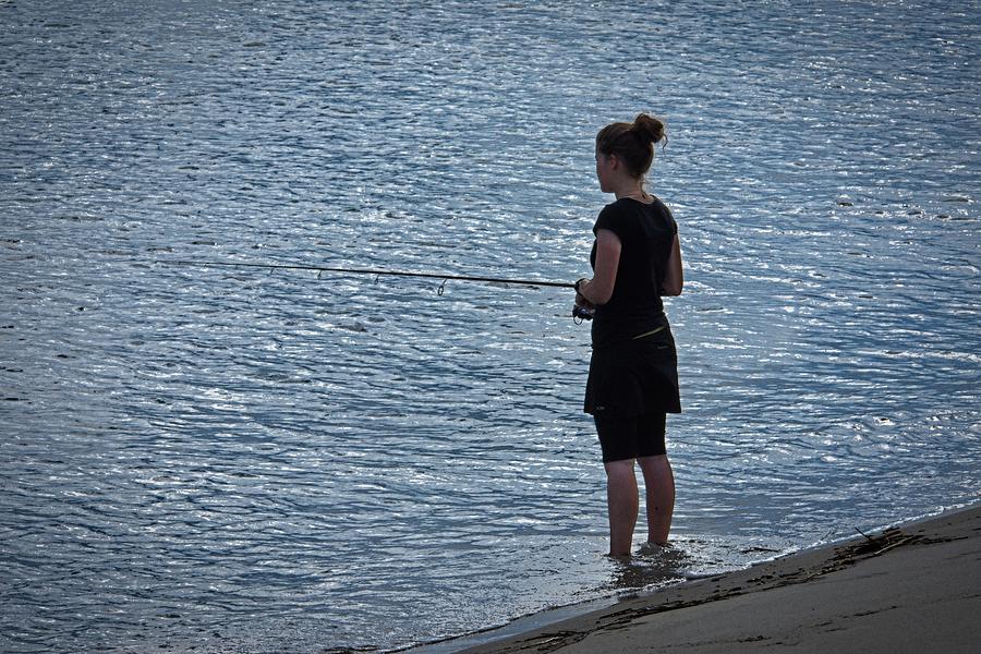 A Girl Fishing On the Beach Photograph by Guy Whiteley