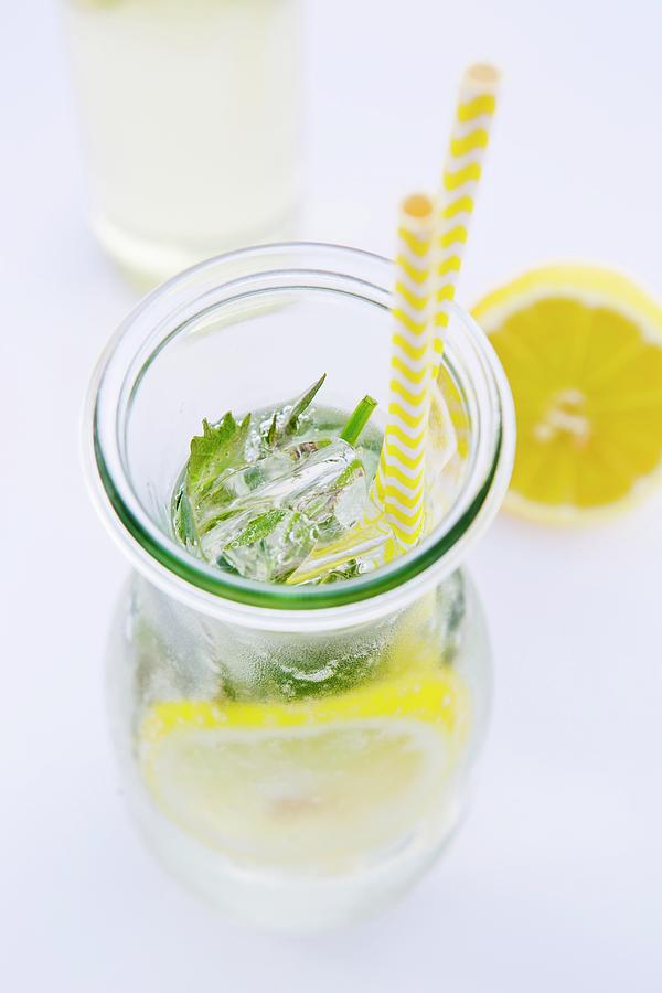 A Glass Carafe Of Lemonade And Peppermint Seen From Above Photograph by Esther Hildebrandt