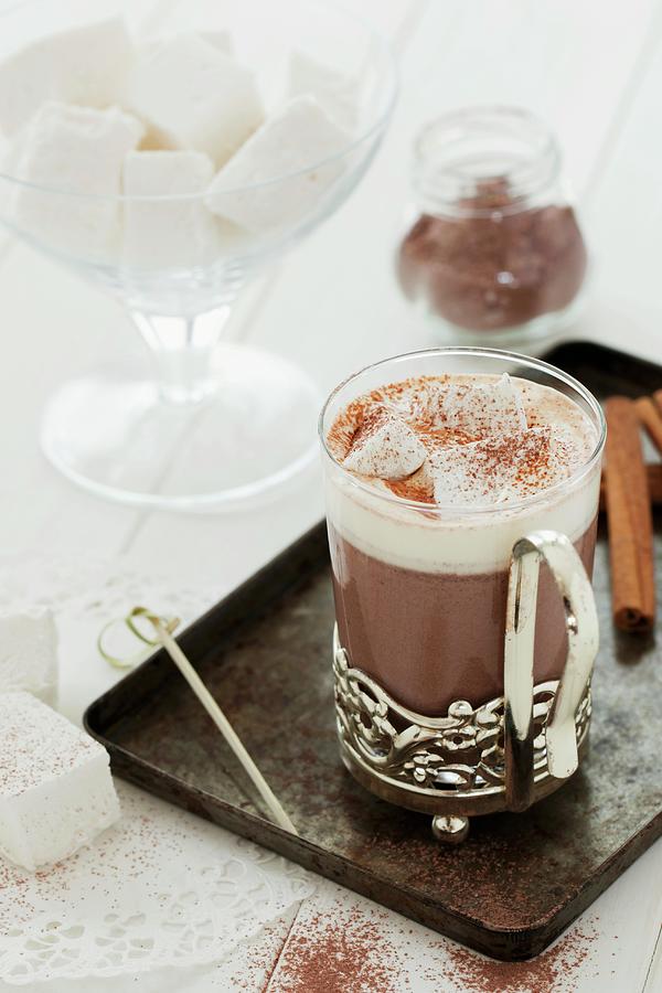 A Glass Cup Of Hot Chocolate With Whipped Cream And Homemade Marshmallow Cubes Photograph by Jane Saunders