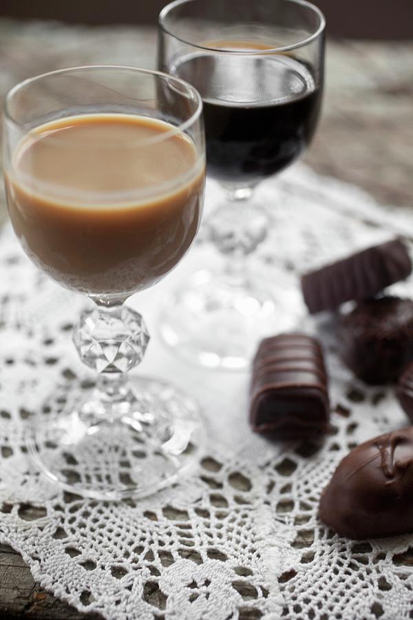 A Glass Of Baileys And One Of Kahlua With Assorted Filled Chocolates To