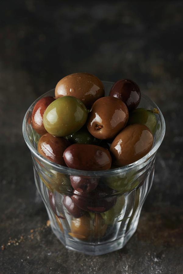 A Glass Of Black And Green Olives Photograph by Charlotte Kibbles