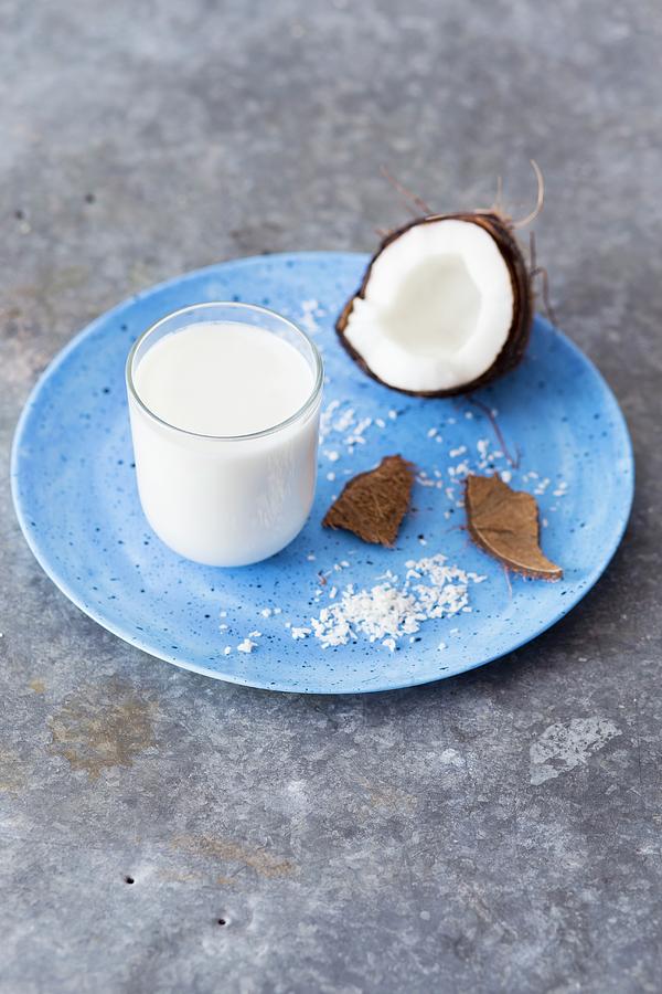 A Glass Of Coconut Milk, Fresh Coconut And Grated Coconut Photograph by Malgorzata Laniak