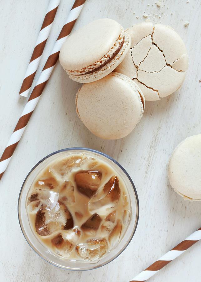 A Glass Of Iced Coffee Served With Coffee Macaroons Photograph by Jane Saunders