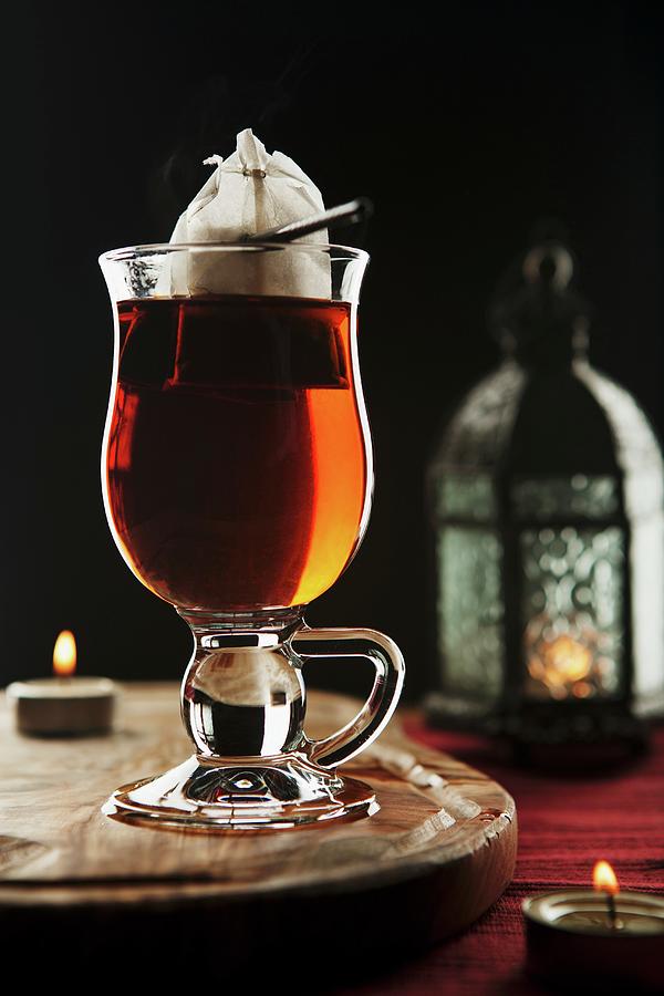 A Glass Of Tea, A Lantern And A Tea Light Photograph by Yellow Street Photos
